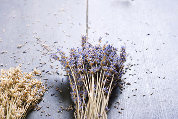 Dried lavender bunch variation on black wooden table background