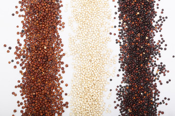 Black red and white quinoa seeds isolated on white background. Top view