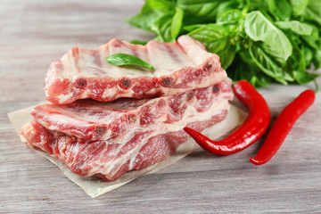Fresh raw pork ribs on wooden table