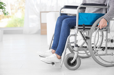 Woman in wheelchair indoors