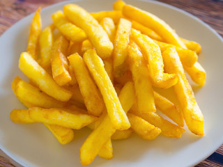 fried potatoes in white plate