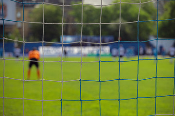 goalkeeper behind the net of the gate