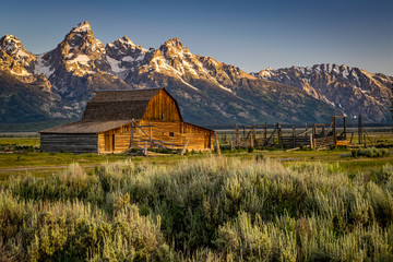CLOSE VIEW OF MORMON ROW BARN AND THE GRAND TETONS WYOMING