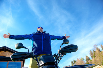 Man on the ATV Quad Bike on the mountains road.