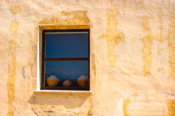 Window. The old window with three earthenware jugs. Cadiz, Andalusia, Spain.