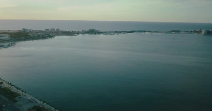 Aerial footage of Luanda's bay with sunset.