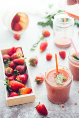 Healthy smoothie with strawberries over a white background. Detox, diet, healthy, vegetarian food concept with copy space.