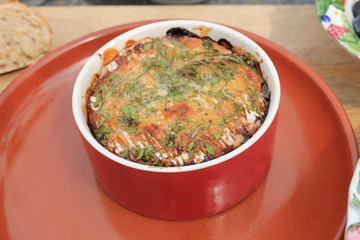 bowl with baked cheese