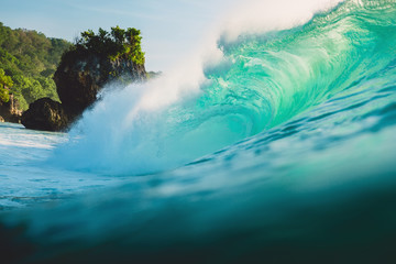 Big wave in ocean. Breaking turquoise wave in Bali