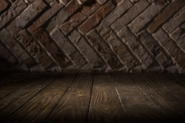 close up view of wooden tabletop and brick wall background