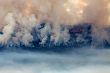 Remote Australian Blue Mountains National Park bushfire with smoke layers over mountain tops