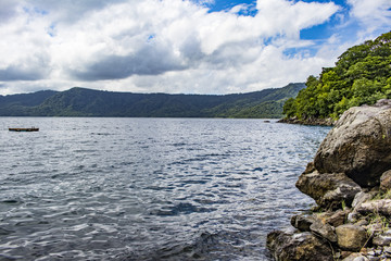 Rocks and Trees Line the Extinct Volcano Crater which the Laguna de Apoyo Lake Fills in Nicaragua