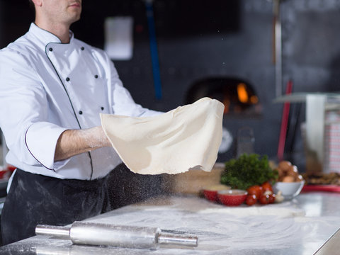 Chef Throwing Up Pizza Dough