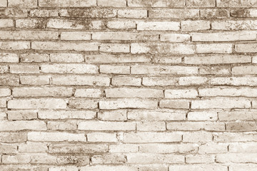 Cream colors and white brick wall art concrete or stone texture background in wallpaper limestone abstract paint to flooring and homework/Brickwork or stonework clean grid uneven interior rock old.