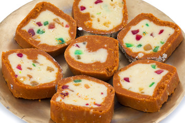 Indian Sweet Colourful Mawa Peda Also know as pedha or peday Indian Popular Sweet Food Made up of Mawa, Milk and Sugar isolated on white background