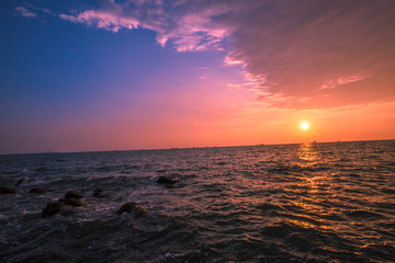 Sunset by the sea Laem Chabang Beach is beautiful in nature. Popular photographers keep the atmosphere in some time. In the Sriracha district. Chonburi Thailand