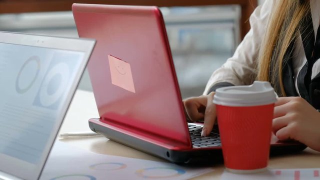 office worker inefficiency. computer education. low typing skills result in tired hands and fingers. woman uses one finger to key in text
