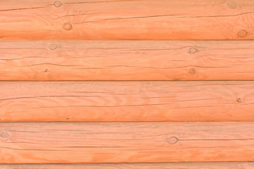 Fototapeta premium Wall of logs in the bath. Background of natural wood