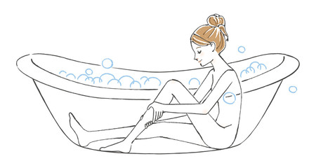 お風呂で脚のマッサージをする女性