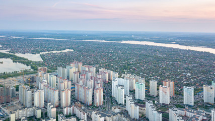Panoramic view of the town of Kiev with the right and left part of the city and the Dnieper river at sunset. Photo from the drone