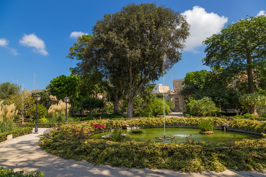 Naxxar, Malta. A picturesque view with a fountain in the gardens of the Palazzo Parisio