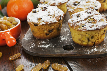 Mandarin muffins with raisins on the table