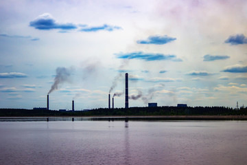 chimneys of the plant pollute the air