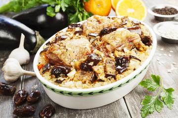 Chicken thigh baked with rice, eggplant and figs