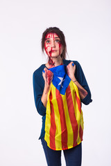 The victim woman holds the flag of Catalonia. Protest against terrorism.