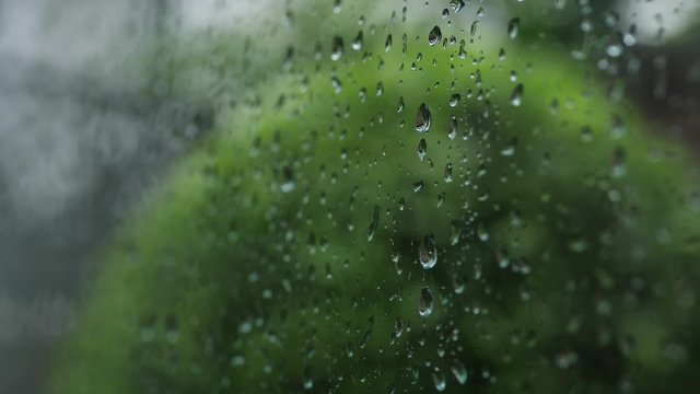 water rain drops on glass window, rainy day weather