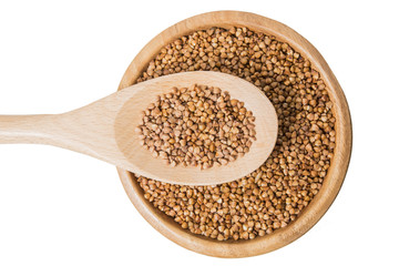 buckwheat in a spoon on white background