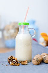 Seeds, walnuts, almond raw vegan milk with banana. Healthy food concept.