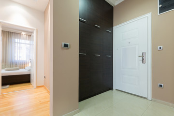 Corridor with closet in hotel room