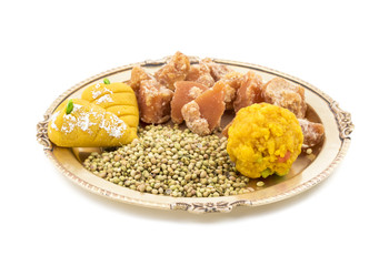Group of jaggery with Coriander Seeds or Indian Sweets also Know as Gur, Goor or Gud isolated on White Background