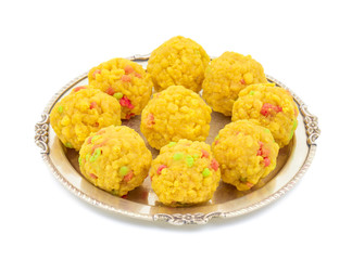 Laddu also know as laddoo, ladoo, laddo are ball-shaped sweets popular in the Indian festivals. Laddu are made of flour, minced dough and sugar with other ingredients. laddu on white background