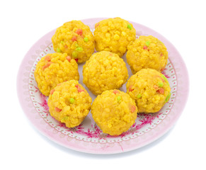 Laddu also know as laddoo, ladoo, laddo are ball-shaped sweets popular in the Indian festivals. Laddu are made of flour, minced dough and sugar with other ingredients. laddu on white background