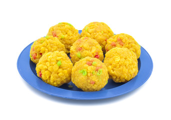 Laddu also know as laddoo, ladoo, laddo are ball-shaped sweets popular in the Indian festivals. Laddu are made of flour, minced dough and sugar with other ingredients. laddu on white background
