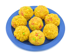 Laddu also know as laddoo, ladoo, laddo are ball-shaped sweets popular in the Indian festivals. Laddu are made of flour, minced dough and sugar with other ingredients. laddu on white background