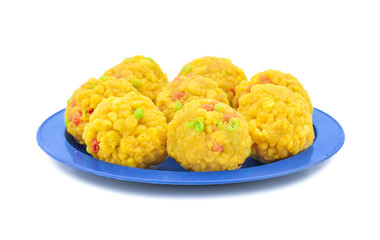 Laddu also know as laddoo, ladoo, laddo are ball-shaped sweets popular in the Indian festivals. Laddu are made of flour, minced dough and sugar with other ingredients. laddu on white background