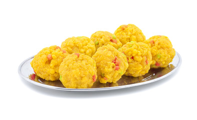 Laddu also know as laddoo, ladoo, laddo are ball-shaped sweets popular in the Indian festivals. Laddu are made of flour, minced dough and sugar with other ingredients. laddu on white background