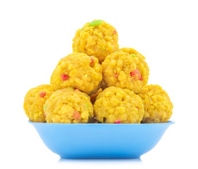 Laddu also know as laddoo, ladoo, laddo are ball-shaped sweets popular in the Indian festivals. Laddu are made of flour, minced dough and sugar with other ingredients. laddu on white background