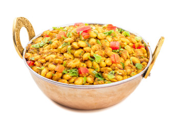Indian Cuisine Rajma Masala or Rajmah is a South Asian Vegetarian Dish Consisting of White Kidney Beans in a thick gravy with many Indian whole spices and usually served with Chapati and food
