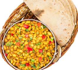 Indian Cuisine Rajma Masala or Rajmah is a South Asian Vegetarian Dish Consisting of White Kidney Beans in a thick gravy with many Indian whole spices and usually served with Chapati and food
