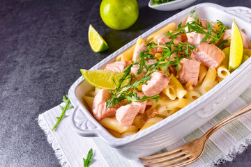 Salmon with penne noodle and arugula