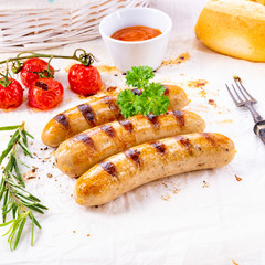 delicious bratwurst with ketchup and fresh rolls
