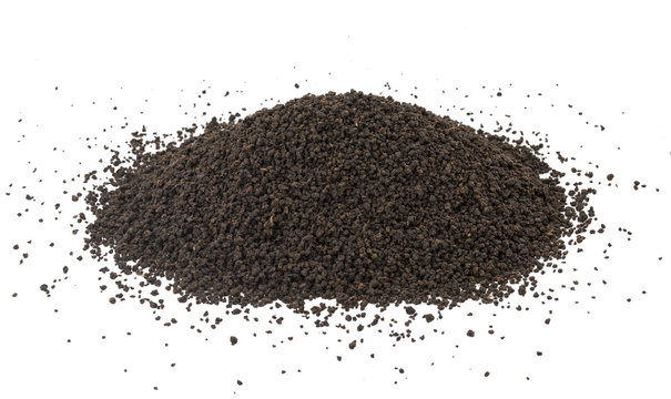 Pile of Aromatic Black Tea Loose or Dried Tea Leaves isolated on White Background