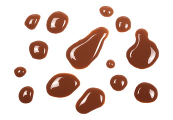Spilled chocolate milk puddle isolated on white background, top view