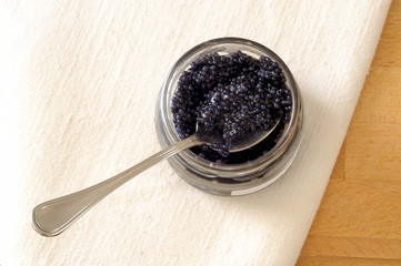 top view of black lumpfish eggs in a jar