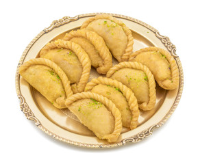 Gujiya or Gujia is a indian sweet dumpling made with suji, Maida or wheat flour and stuffed with...