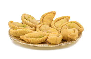 Gujiya or Gujia is a indian sweet dumpling made with suji, Maida or wheat flour and stuffed with khoya. It is common in North India, particularly in Bihar, Uttar Pradesh, Madhya Pradesh or Rajasthan
